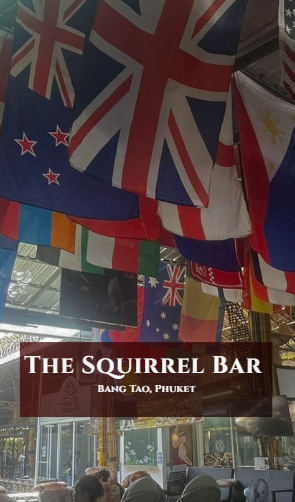International flags hanging from the ceiling of The Squirrel Bar in Bang Tao, Phuket